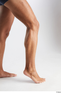 Nathaniel  1 calf flexing nude side view 0003.jpg